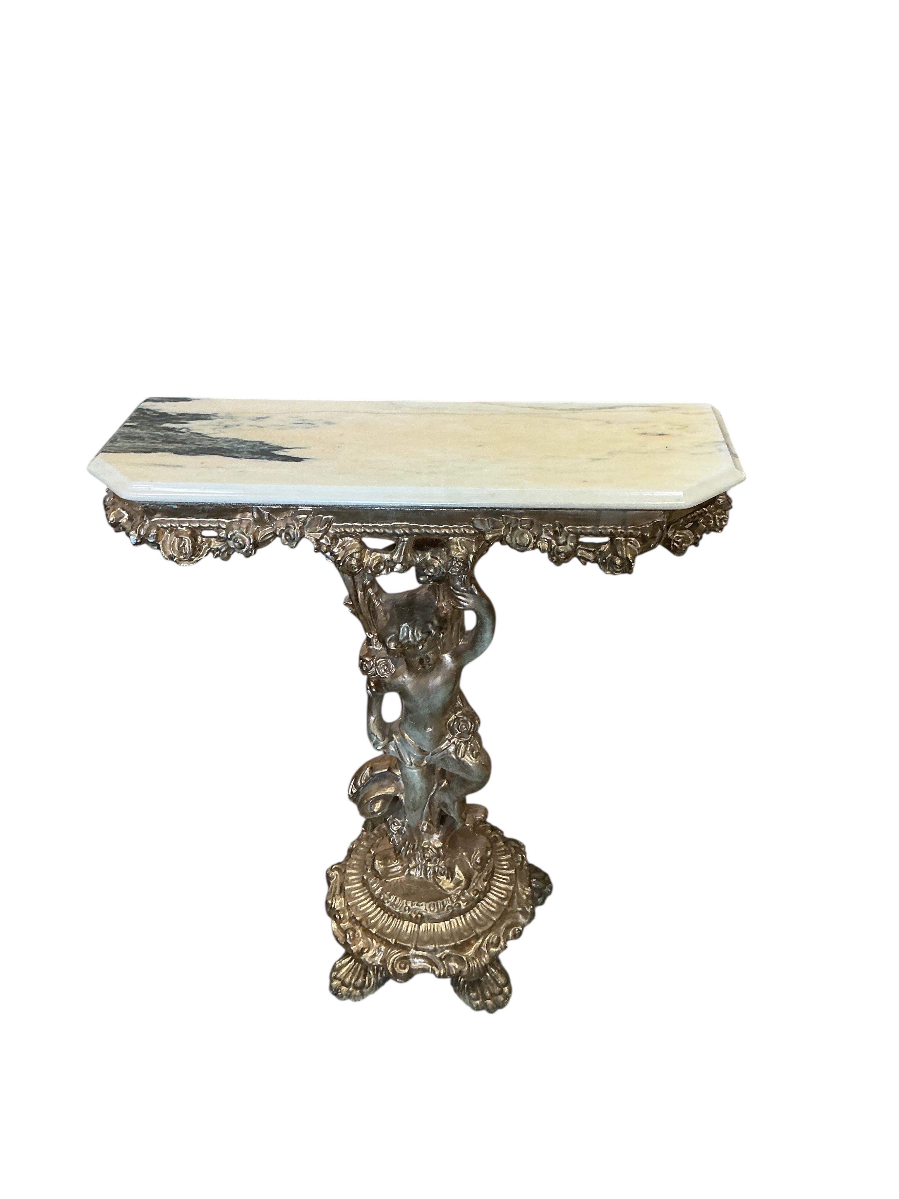 A gilt composition cherub column console table with faux marble top and a similar wall mirror, table width 73cm, depth 26cm, height 83cm.